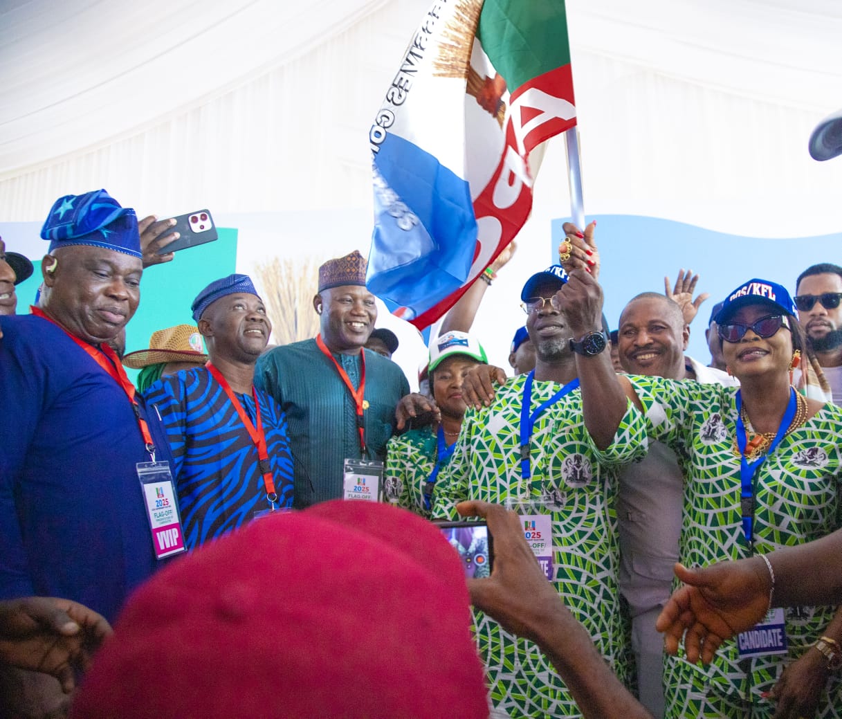 segun-odunmbaku-running-mate-kafaya-layeni-receive-party-flags-at-flagoff-ceremony-for-57-chairmanship-candidates-of-lagos-apc.jpg