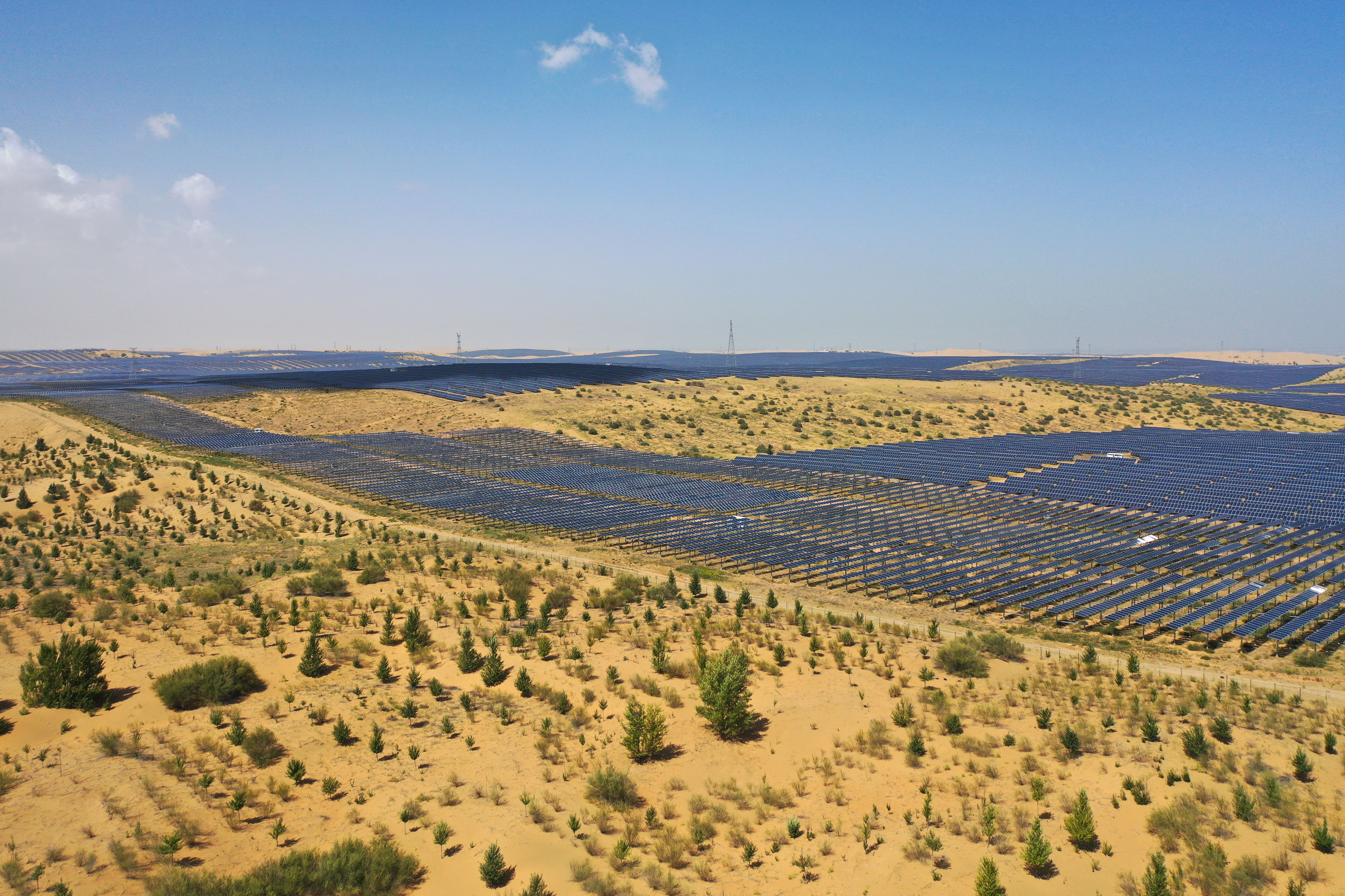 solar-power-project-transforms-desert-into-energy-hub-an-aerial-drone-photo-taken-on-sept-3-2025-shows-a-photovoltaic-and-desertification-control-project-in-kubuqi-desert-north-chinas-inner-mongol-1.jpg